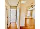 The hallway features hardwood floors and leads to the rooms of the house, offering a smooth transition at 177 Highland Woods Ct, Denver, NC 28037