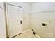 Functional laundry area with tile flooring, utility connections, and storage shelf at 177 Highland Woods Ct, Denver, NC 28037