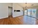 Elegant living room with hardwood floors, stylish lighting, and sliding glass doors to outdoor deck at 177 Highland Woods Ct, Denver, NC 28037