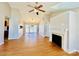 Spacious living room with hardwood floors, fireplace, and vaulted ceilings, brightened by natural light at 177 Highland Woods Ct, Denver, NC 28037