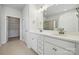 Bathroom with double sink vanity, white cabinets, elegant fixtures, and a view of the glass shower at 2014 Mantle Ridge Dr, Indian Trail, NC 28079