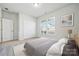 Bedroom with neutral carpet, windows letting in natural light and door to the closet at 2014 Mantle Ridge Dr, Indian Trail, NC 28079