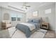 Inviting bedroom featuring tray ceilings, carpeted floors, neutral decor, and natural light from a window at 2014 Mantle Ridge Dr, Indian Trail, NC 28079