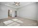 Spacious bedroom with carpeted floors, tray ceilings, plenty of light, and open doorway to the en suite at 2014 Mantle Ridge Dr, Indian Trail, NC 28079