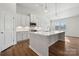 Gourmet kitchen featuring a large island with white countertops and stainless steel appliances at 2014 Mantle Ridge Dr, Indian Trail, NC 28079
