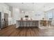 Open kitchen featuring a center island, stainless steel appliances, and an adjacent dining area at 2014 Mantle Ridge Dr, Indian Trail, NC 28079