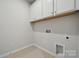 Utility room featuring white cabinets, tile floors, washer hookup, and a dryer vent for laundry appliances at 2014 Mantle Ridge Dr, Indian Trail, NC 28079