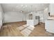 Spacious open-concept living space featuring wood floors and lots of natural light at 2014 Mantle Ridge Dr, Indian Trail, NC 28079