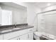Clean and bright bathroom with white cabinets, granite countertop, and glass-enclosed shower at 225 Kennerly Ave # A, Mooresville, NC 28115