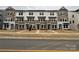 A row of attractive two-story townhomes featuring a combination of light and dark siding and well-manicured lawns at 225 Kennerly Ave # A, Mooresville, NC 28115