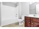 Bathroom features a tub/shower combo, tile floors, and a wooden vanity at 2313 Calabassas Ln, Matthews, NC 28105
