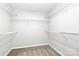 Walk-in closet with shelving and carpeted floor at 2313 Calabassas Ln, Matthews, NC 28105