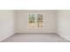 Carpeted bedroom with bright double windows that provide great natural light and backyard views at 237 Miramar Dr, York, SC 29745