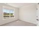 A bright bedroom features a large window with views of trees, creating a serene space at 237 Miramar Dr, York, SC 29745