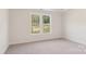 Bedroom with carpet and double window providing natural light and beautiful views of the backyard at 237 Miramar Dr, York, SC 29745