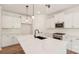 Well-lit kitchen with a large center island, stylish pendant lighting, and modern appliances against white cabinetry at 237 Miramar Dr, York, SC 29745