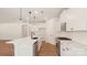 A modern kitchen boasts an expansive island, pristine white cabinetry, and gleaming stainless steel appliances at 237 Miramar Dr, York, SC 29745