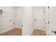 Laundry room featuring hardwood style floors, and easy access to an exterior door at 237 Miramar Dr, York, SC 29745