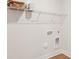 Laundry room featuring wire shelving and utility hook-ups, maximizing organization and convenience at 237 Miramar Dr, York, SC 29745