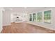 Spacious living room showcasing hardwood floors, recessed lights, and abundant natural light through large windows at 237 Miramar Dr, York, SC 29745