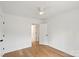 Bedroom featuring hardwood floors, white walls, and a doorway to another room at 2425 Ellen Ave, Charlotte, NC 28208