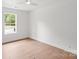 Bright bedroom with light hardwood floors and a window offering natural light at 2425 Ellen Ave, Charlotte, NC 28208