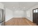 Living room with hardwood floors, recessed lighting, ceiling fan, and a modern design that provides ample space at 2425 Ellen Ave, Charlotte, NC 28208