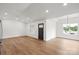 Open living space with hardwood flooring, recessed lighting, and neutral paint perfect for entertaining and relaxation at 2425 Ellen Ave, Charlotte, NC 28208