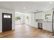 Open living space featuring hardwood floors, recessed lighting, connecting to a stylish kitchen with modern appliances at 2425 Ellen Ave, Charlotte, NC 28208