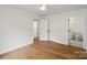 Bedroom featuring hardwood floors and access to the bathroom at 2429 Ellen Ave, Charlotte, NC 28208