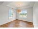 Bright bedroom featuring hardwood floors, recessed lighting and a modern ceiling light at 2429 Ellen Ave, Charlotte, NC 28208