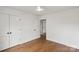 Bedroom featuring hardwood floors and closet at 2429 Ellen Ave, Charlotte, NC 28208