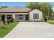 Charming single-story home with a well-manicured lawn and long concrete driveway at 2429 Ellen Ave, Charlotte, NC 28208