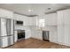 Beautiful kitchen with white cabinets, stainless steel appliances, and ample countertop space at 2429 Ellen Ave, Charlotte, NC 28208