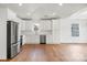 Bright kitchen with white cabinets, hardwood floors, stainless steel appliances and recessed lighting at 2429 Ellen Ave, Charlotte, NC 28208