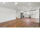 Modern kitchen and living area with hardwood floors, recessed lighting and stainless appliances at 2429 Ellen Ave, Charlotte, NC 28208