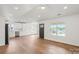 Contemporary living room features hardwood floors, recessed lighting and stainless appliances at 2429 Ellen Ave, Charlotte, NC 28208