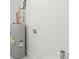 Water heater and hookups for washer and dryer in a utility room at 2429 Ellen Ave, Charlotte, NC 28208