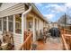 View of the back deck featuring seating, grill, and screened in porch with ceiling fan at 306 W 2Nd St, Cherryville, NC 28021