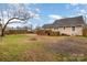Backyard featuring patio deck, fire pit, and wooden fencing at 306 W 2Nd St, Cherryville, NC 28021