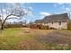 Backyard featuring patio deck, fire pit, and wooden fencing at 306 W 2Nd St, Cherryville, NC 28021