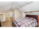 Bedroom featuring a full sized bed, carpeted floors, and a doorway to the outside at 306 W 2Nd St, Cherryville, NC 28021