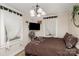 Inviting bedroom with a comfy bed, soft natural light, and a mounted television at 306 W 2Nd St, Cherryville, NC 28021