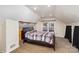 Bright bedroom with a cozy bed and plush carpet at 306 W 2Nd St, Cherryville, NC 28021