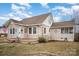 Side view of a cute home with a small porch, classic windows, and a well-kept yard on a sunny day at 306 W 2Nd St, Cherryville, NC 28021