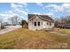 Charming single-story home featuring a cozy front porch and well-maintained lawn on a sunny day at 306 W 2Nd St, Cherryville, NC 28021
