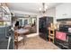 Cozy kitchen open to the living room, featuring black appliances and a charming dining nook for casual dining at 306 W 2Nd St, Cherryville, NC 28021