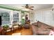 Bright living room features hardwood floors, large windows, and cozy seating for a welcoming atmosphere at 306 W 2Nd St, Cherryville, NC 28021