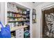 Walk-in pantry offers ample storage space with shelves fully stocked with food and household items at 306 W 2Nd St, Cherryville, NC 28021