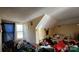 A cluttered bedroom with an assortment of items scattered around and butterfly decor on wall at 3181 N Olivers Cross Rd, Newton, NC 28658